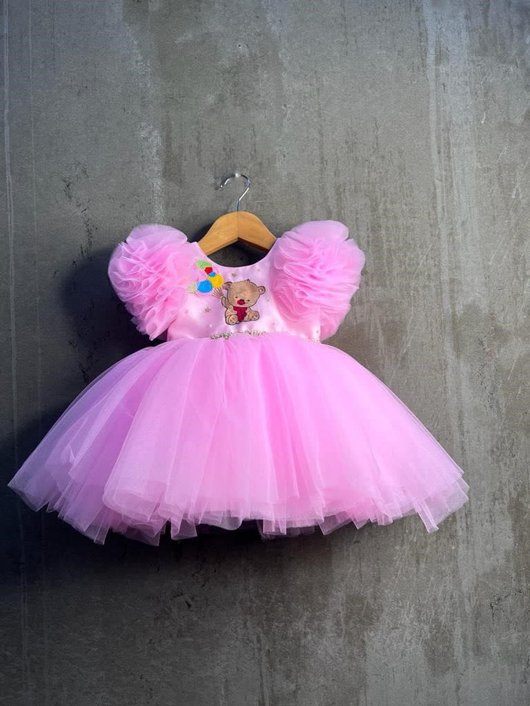 Pink teddy with balloon