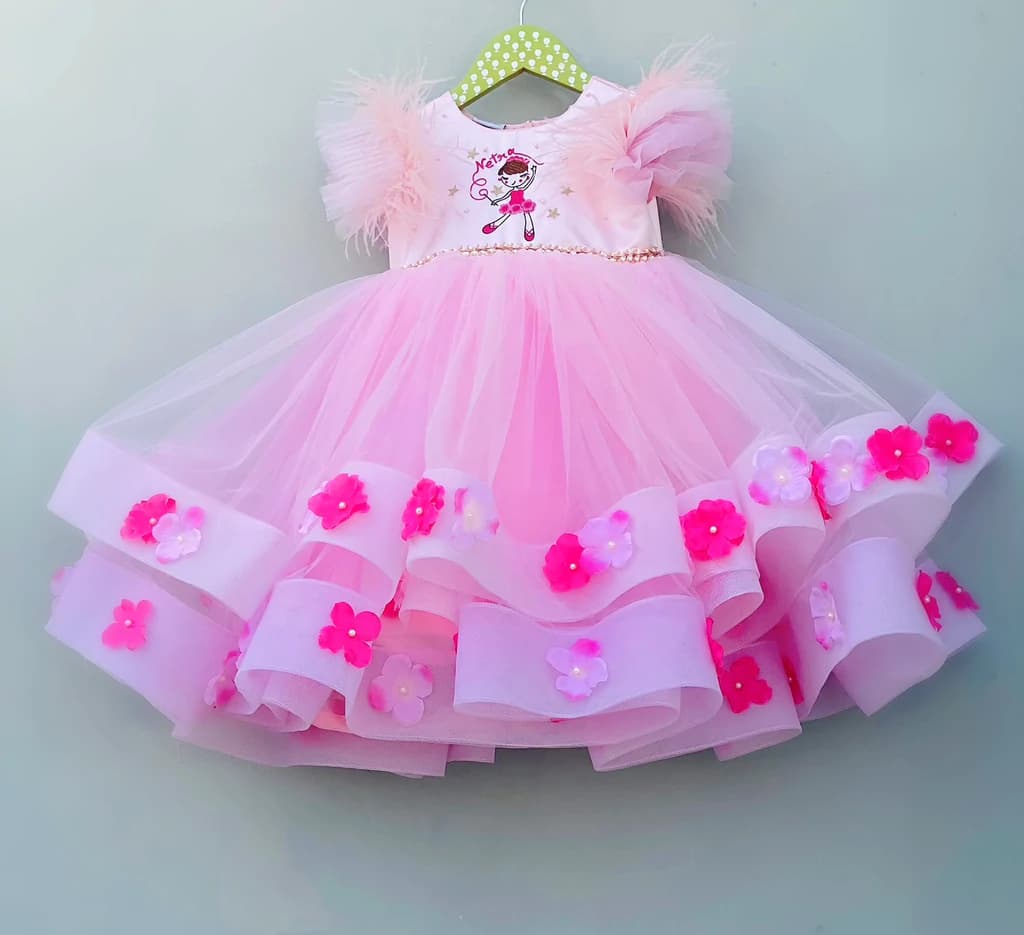 Pink flared frock with feather sleeves